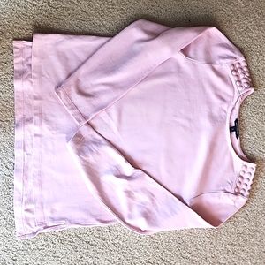 I'm selling a pretty pink sweater from Banana Republic in size medium.